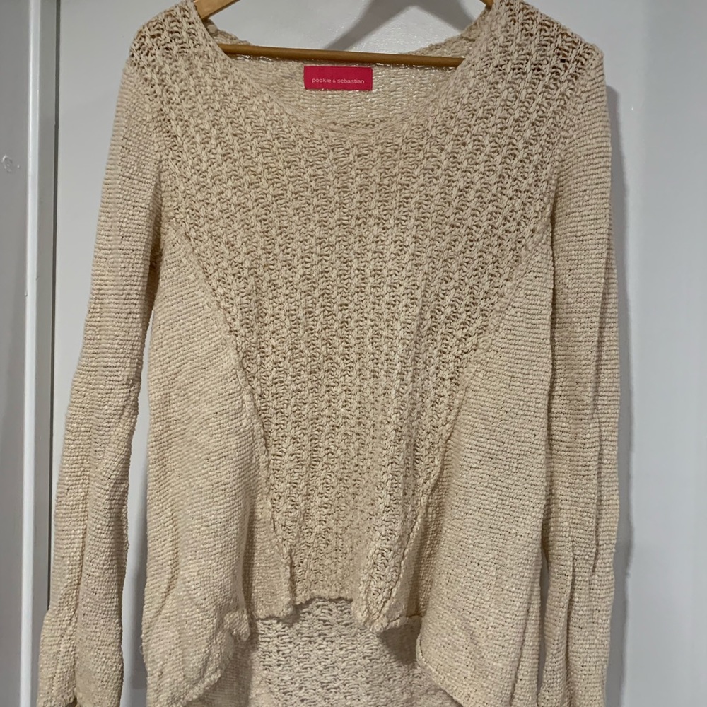 Loose fit uneven length sweater
